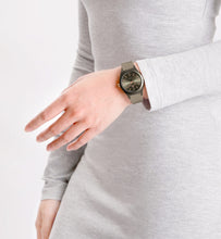 Load image into Gallery viewer, Person wearing a smartwatch on a plain background
