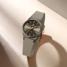 Load image into Gallery viewer, Gray wristwatch with a dark face on a beige surface
